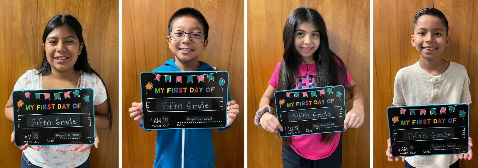 students with first day of 5th grade signs