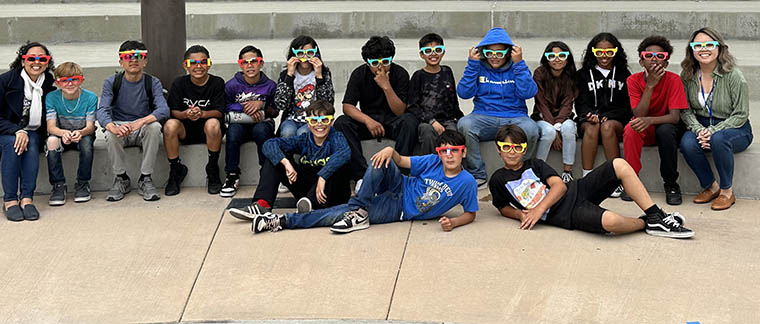 students in Outdoor Learning Center wearing sunglasses