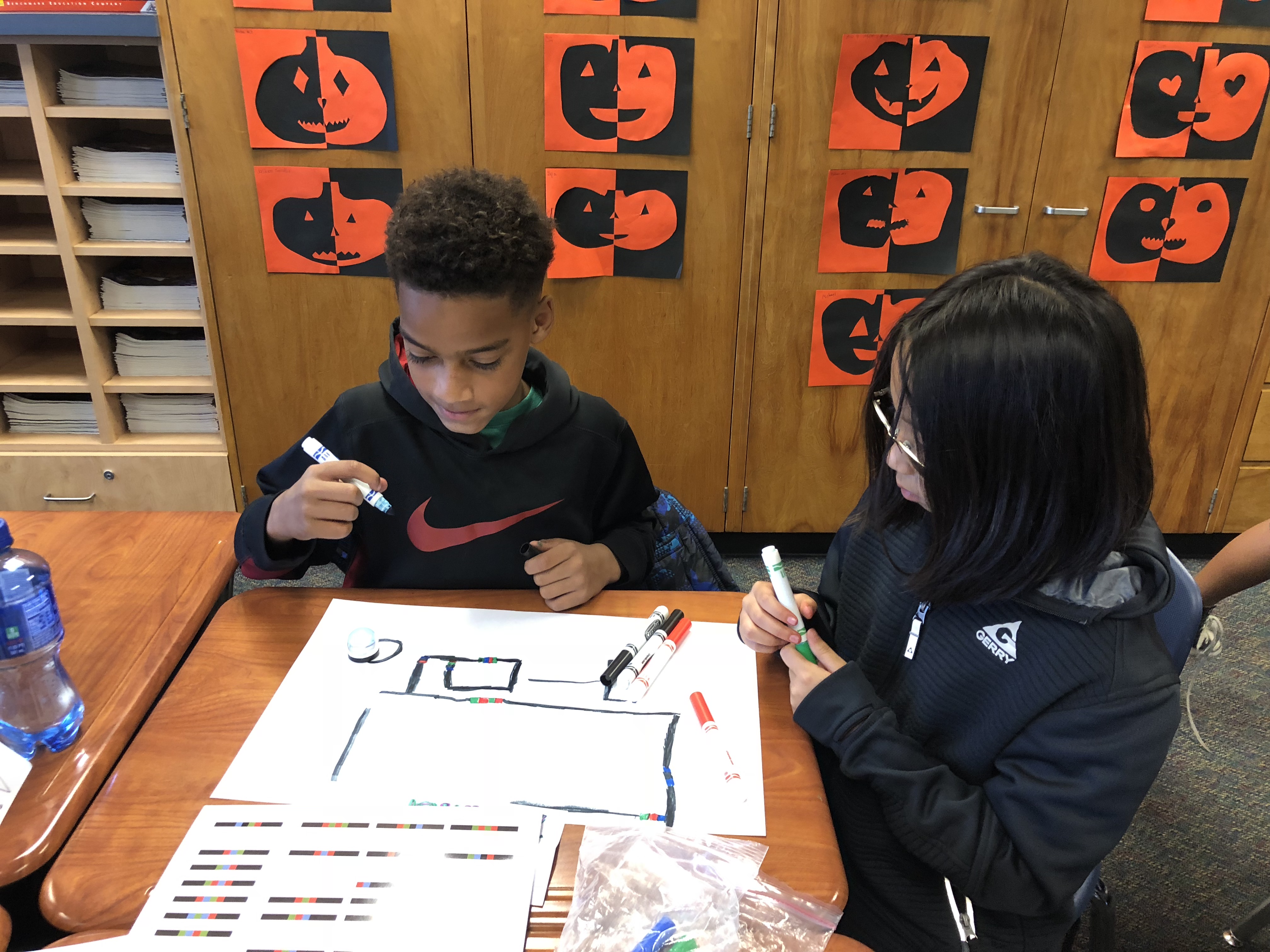 students programming ozobots